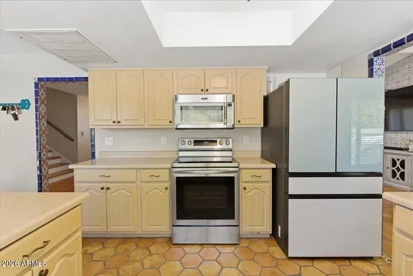 a view of a swimming pool with potted plants