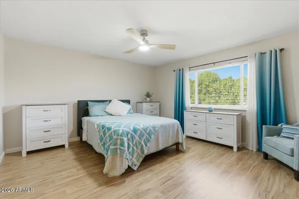 a kitchen with a stove top oven and refrigerator