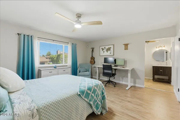 a large kitchen with kitchen island a large counter top space a sink stainless steel appliances and cabinets