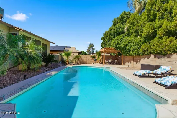 a bathroom with double vanity sink and a mirror