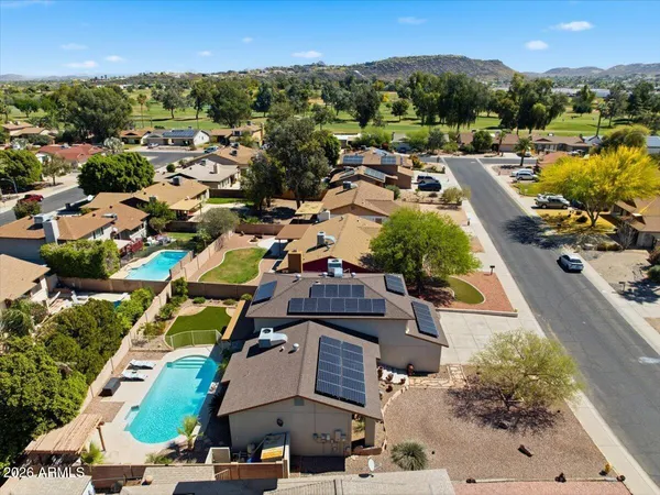 a view of house with a big yard