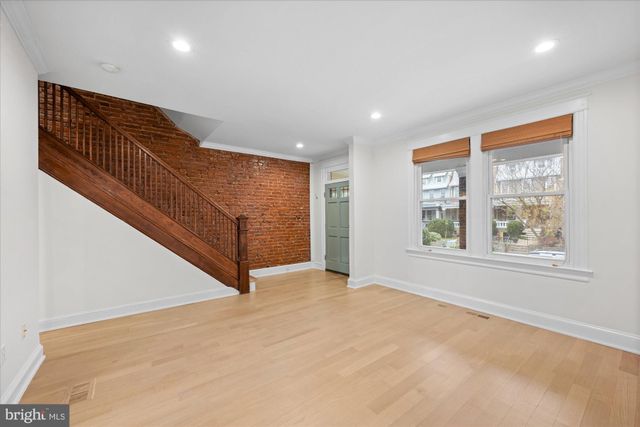 a view of an empty room with windows