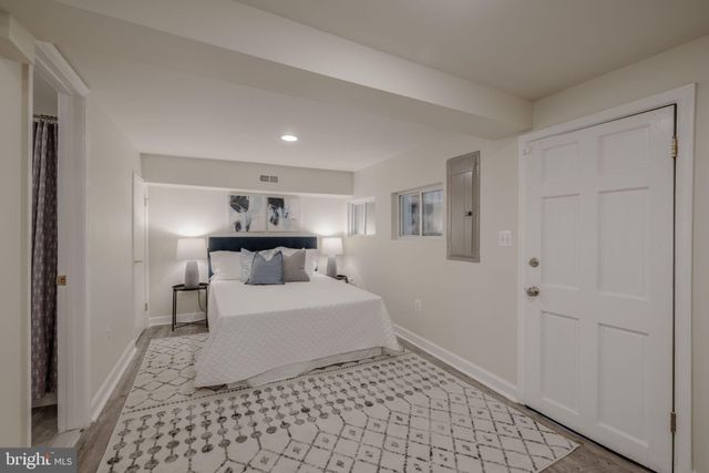 a bathroom with a toilet sink vanity tub and shower