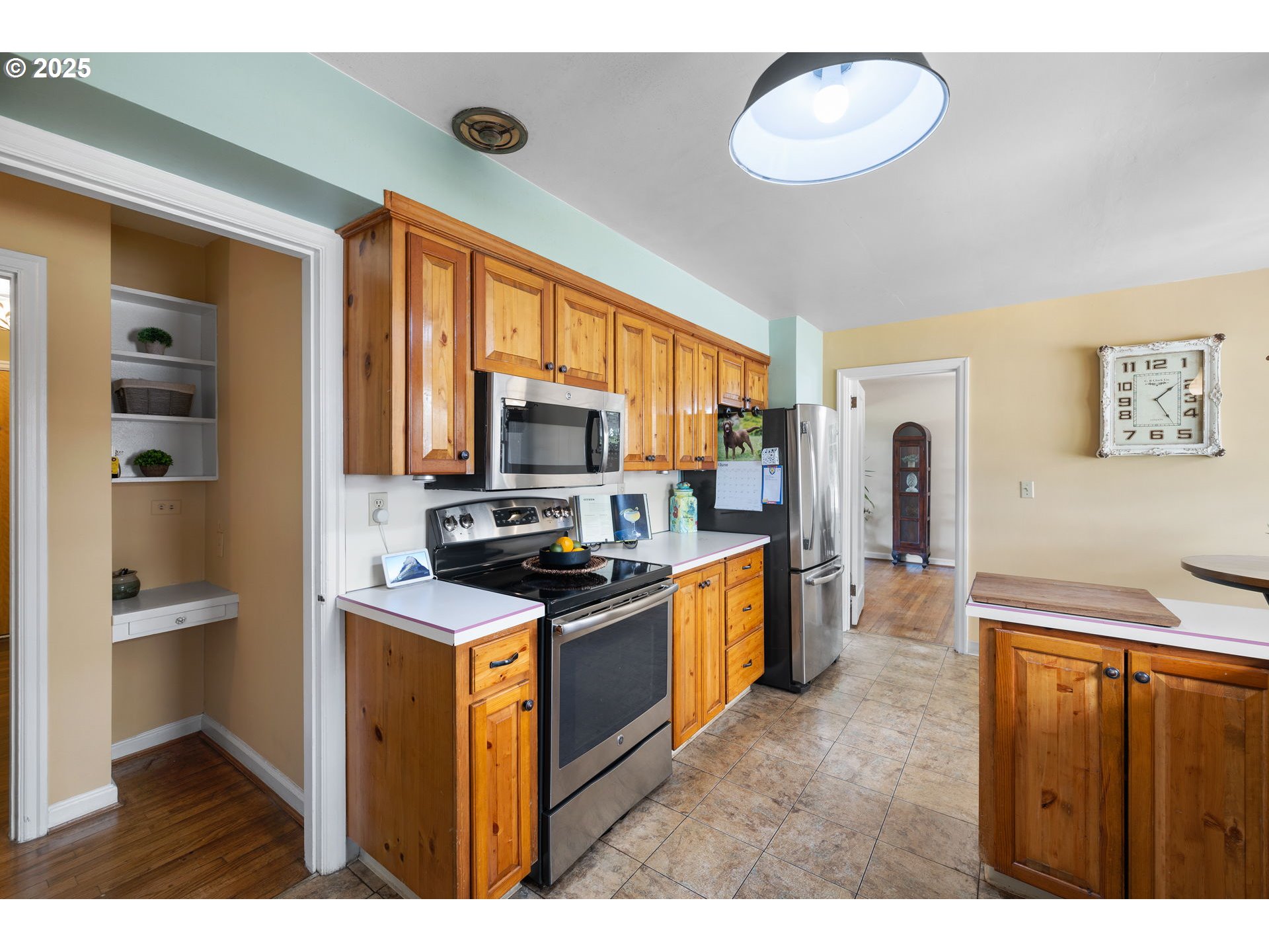 632 Northeast Everett Street Camas, WA 98607 - Photo 19 of 47 a kitchen with stainless steel appliances granite countertop a refrigerator a stove top oven a sink and dishwasher