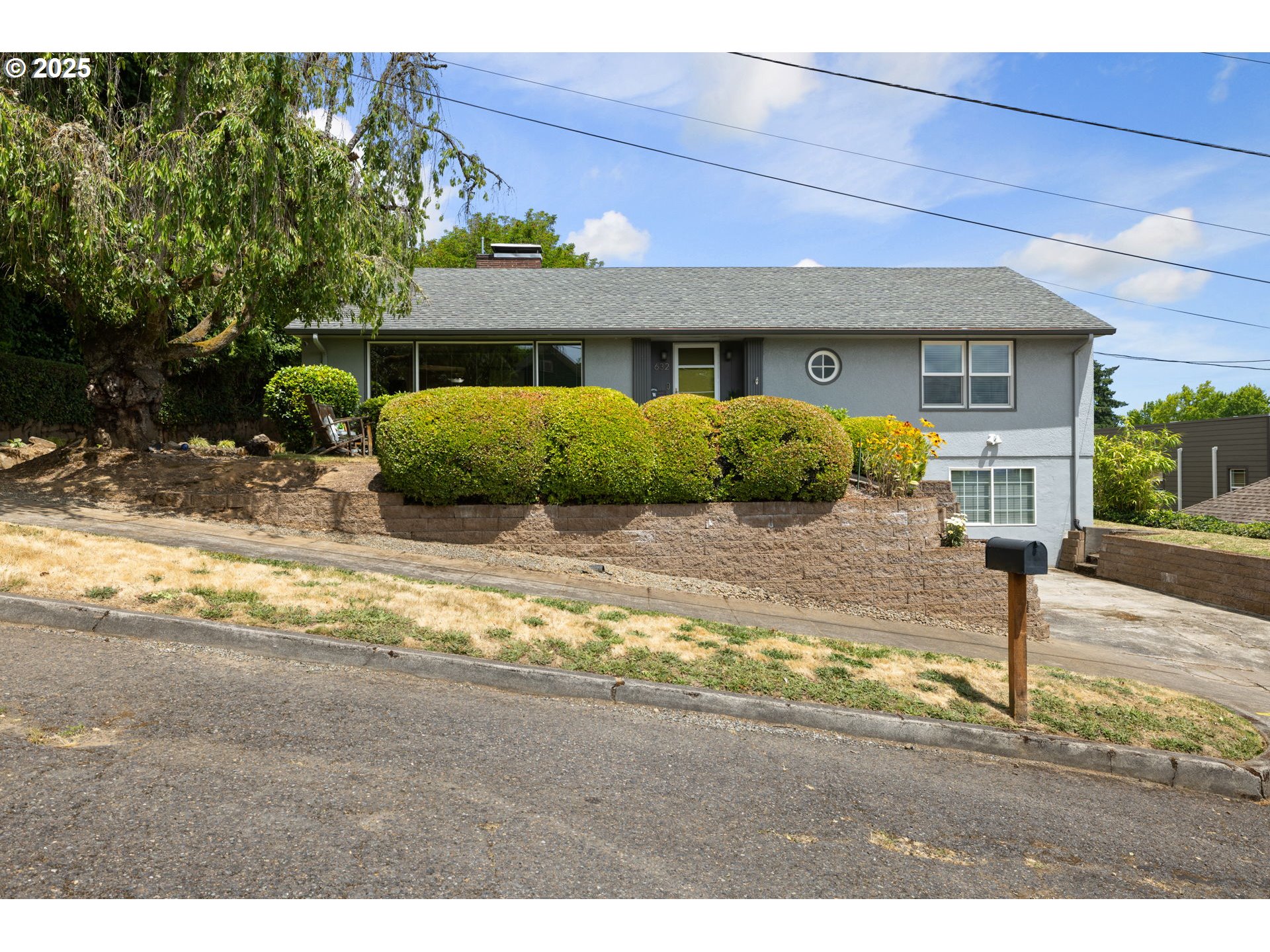 632 Northeast Everett Street Camas, WA 98607 - Photo 2 of 47 a front view of a house with a yard outdoor seating and garage