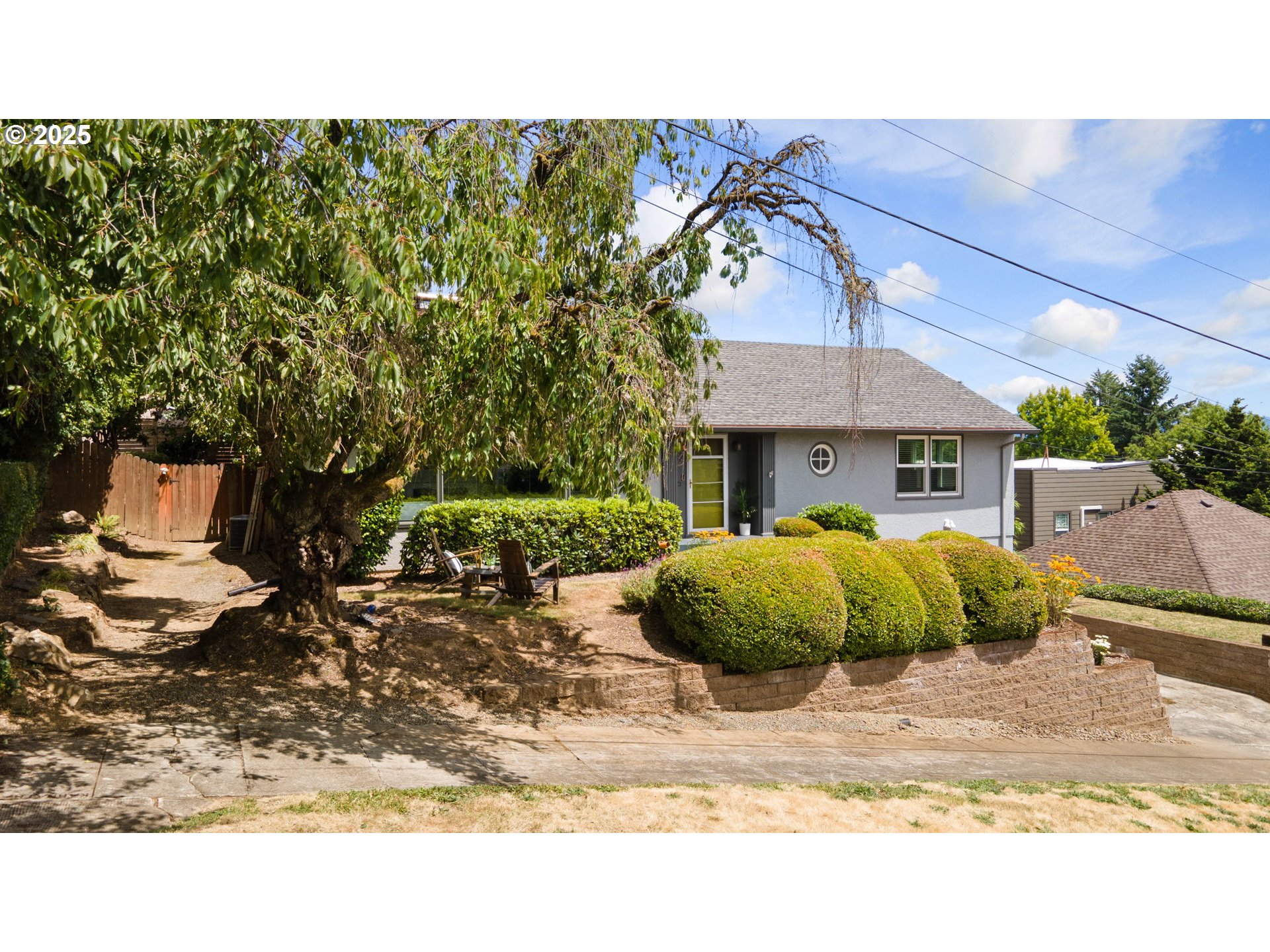 632 Northeast Everett Street Camas, WA 98607 - Photo 5 of 47 a backyard of a house with a garden and barbeque oven