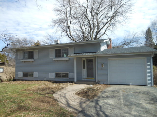 111 Perth Road Cary, IL 60013 - Photo 1 of 6 a front view of a house with a yard and garage