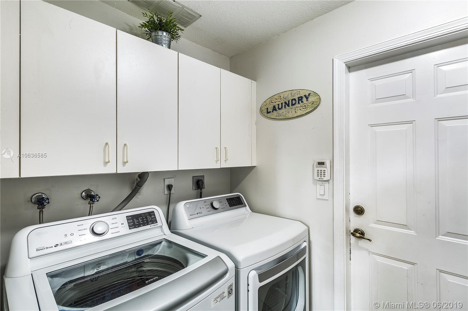 12470 Southwest 143rd Lane Miami, FL 33186 - Photo 18 of 21 Spacious laundry room adjacent to the entrance of the 2-car garage.