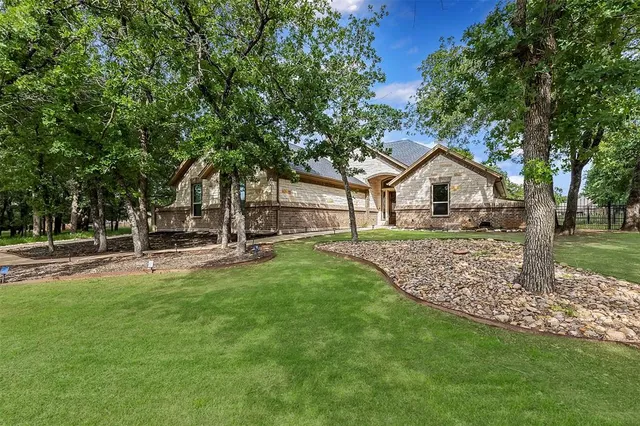 a view of a house with a yard porch and sitting area