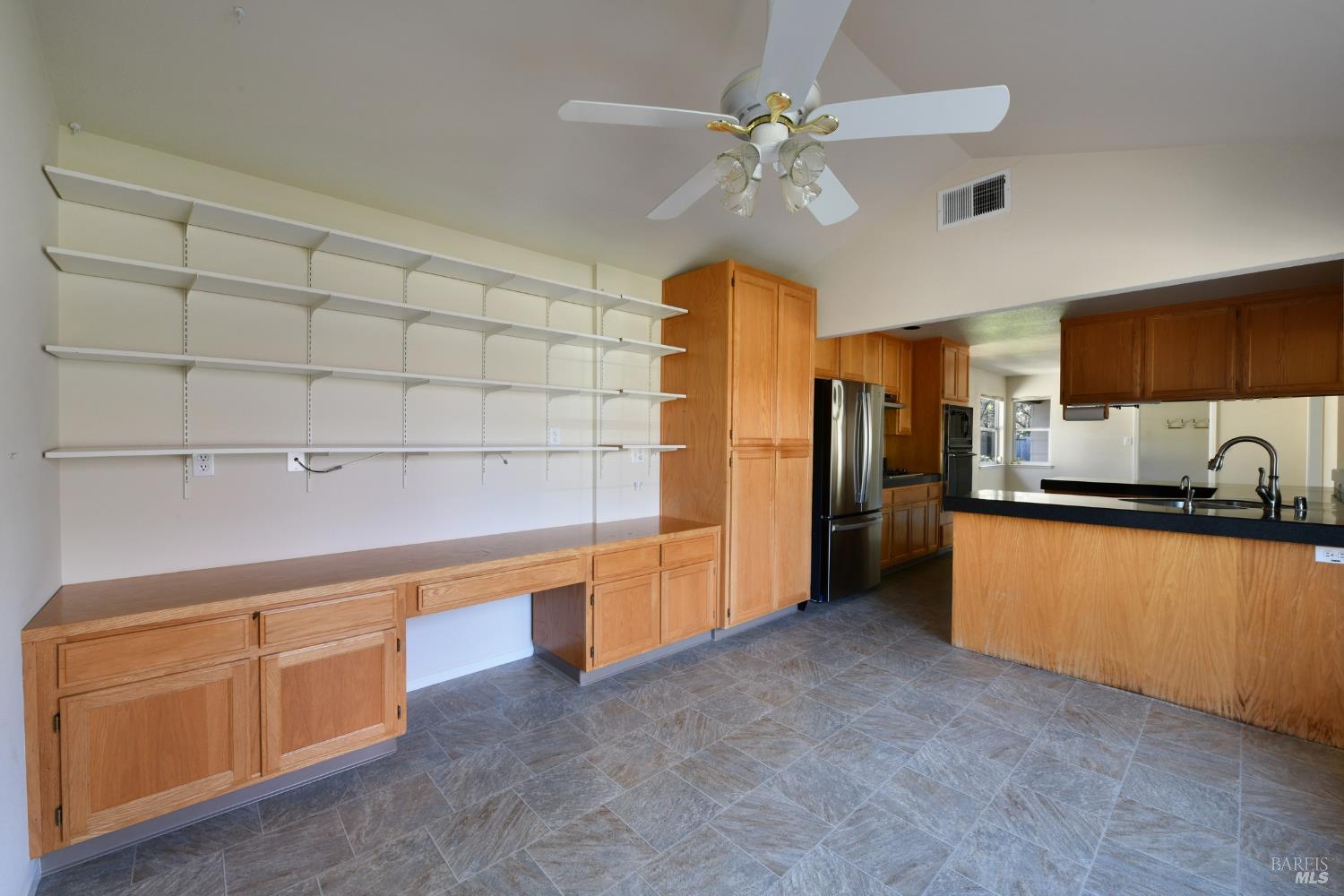135 Fulton Place Windsor, CA 95492 - Photo 26 of 41 a large kitchen with cabinets and stainless steel appliances