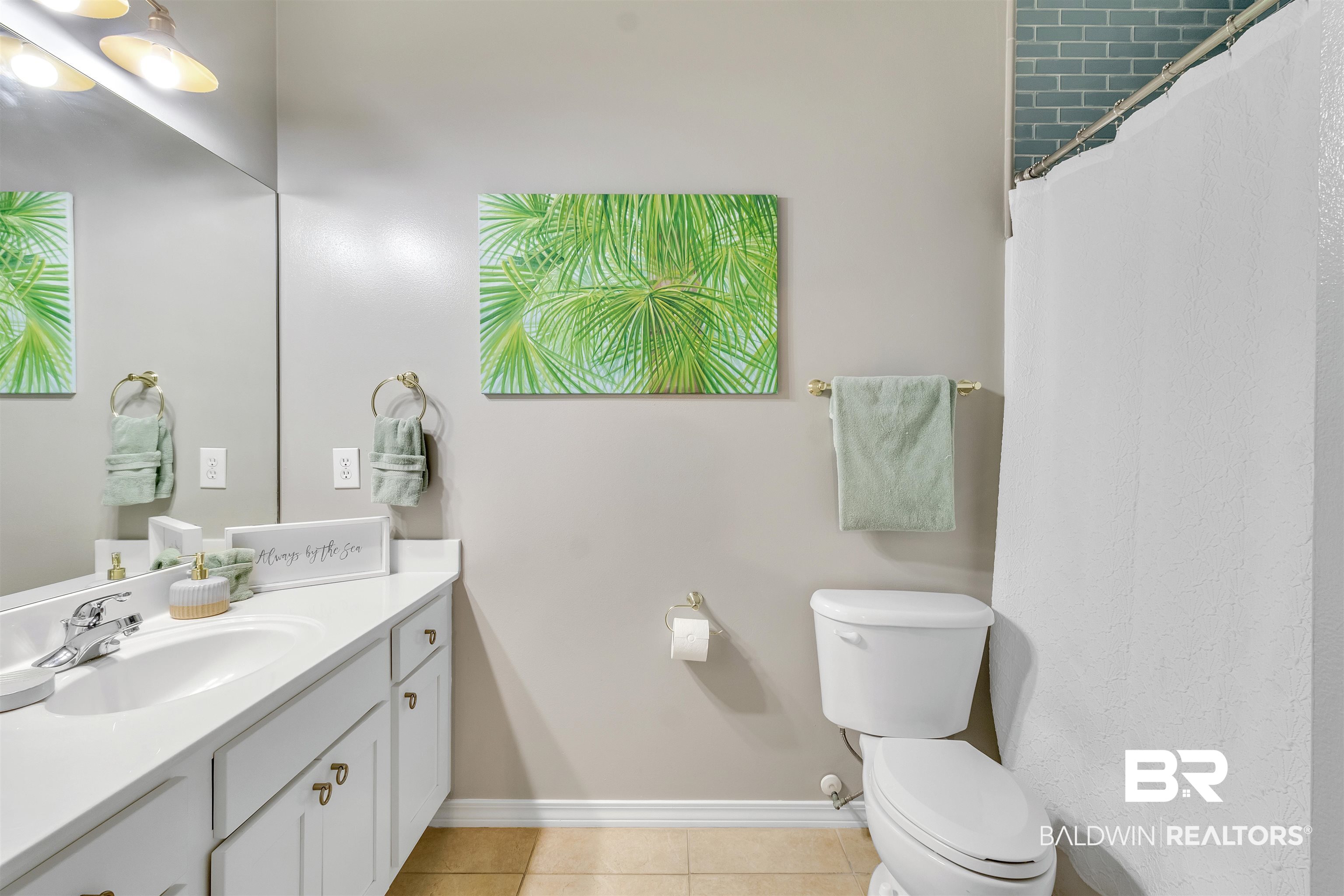4324 B Lindsey Lane, Unit 4324B Orange Beach, AL 36561 - Photo 13 of 33 Bathroom with tile patterned flooring, baseboards, vanity, and toilet