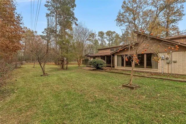 a house that has a tree in front of it