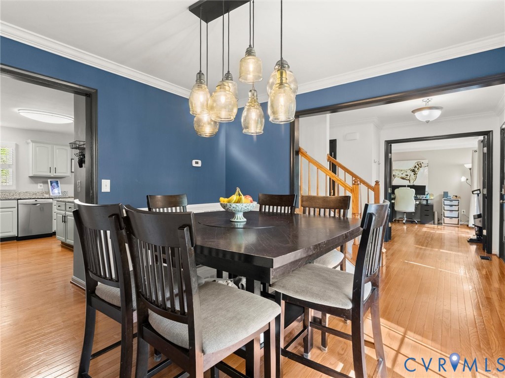 126 Reedy Creek Road Louisa, VA 23093 - Photo 19 of 68 Dining area featuring hardwood floors, a modern ch