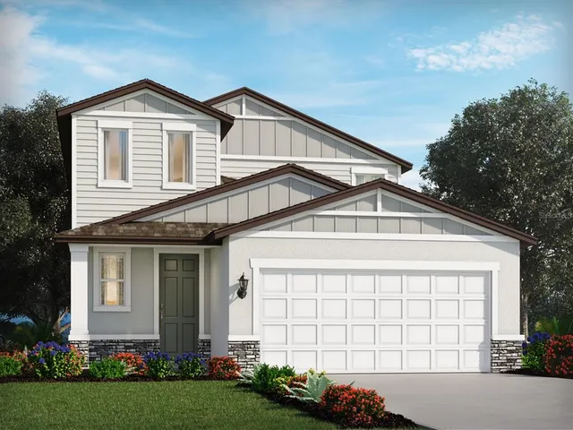 a view of a house with a yard and plants