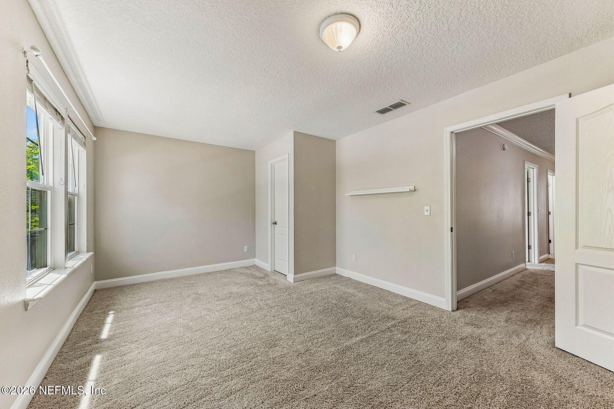 12198 Ridge Crossing Way Jacksonville, FL 32226 - Photo 41 of 67 an empty room with windows and closet
