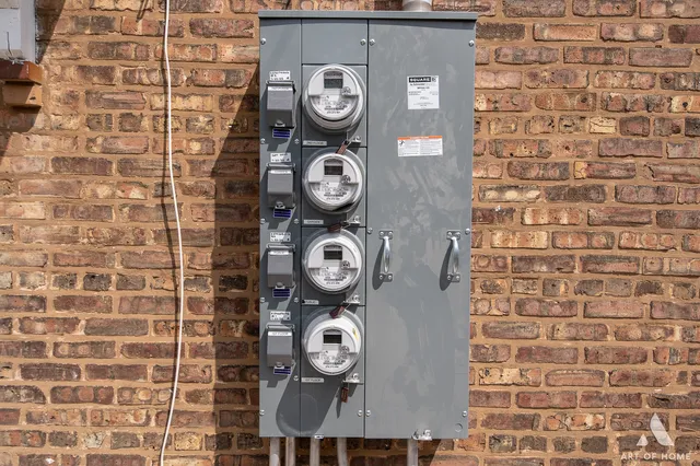 a front view of a house with a fountain and a clock on the wall