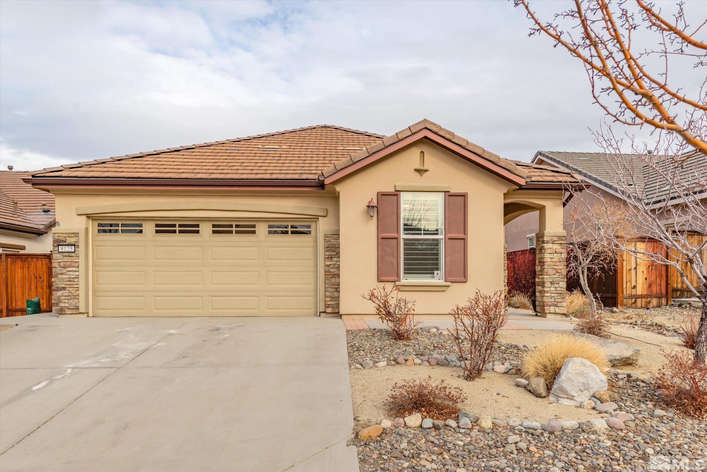 9125 Heritage Ridge Court Reno, NV 89523 - Photo 30 of 40 a front view of a house with a yard