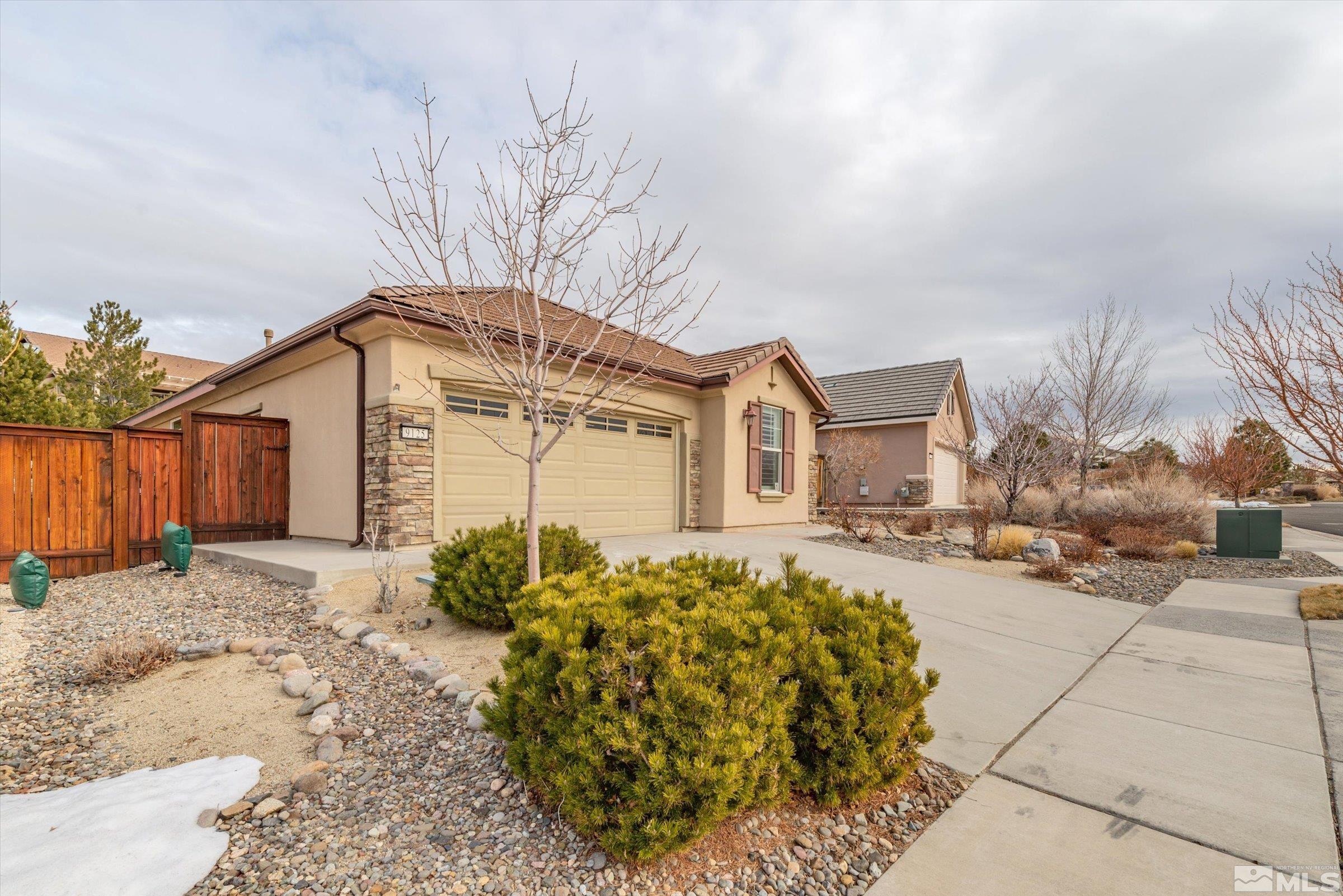 9125 Heritage Ridge Court Reno, NV 89523 - Photo 3 of 40 a front view of a house with garden