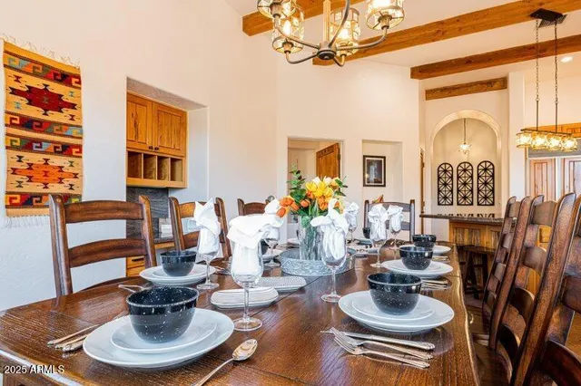 a bed sitting in a spacious bedroom next to a window