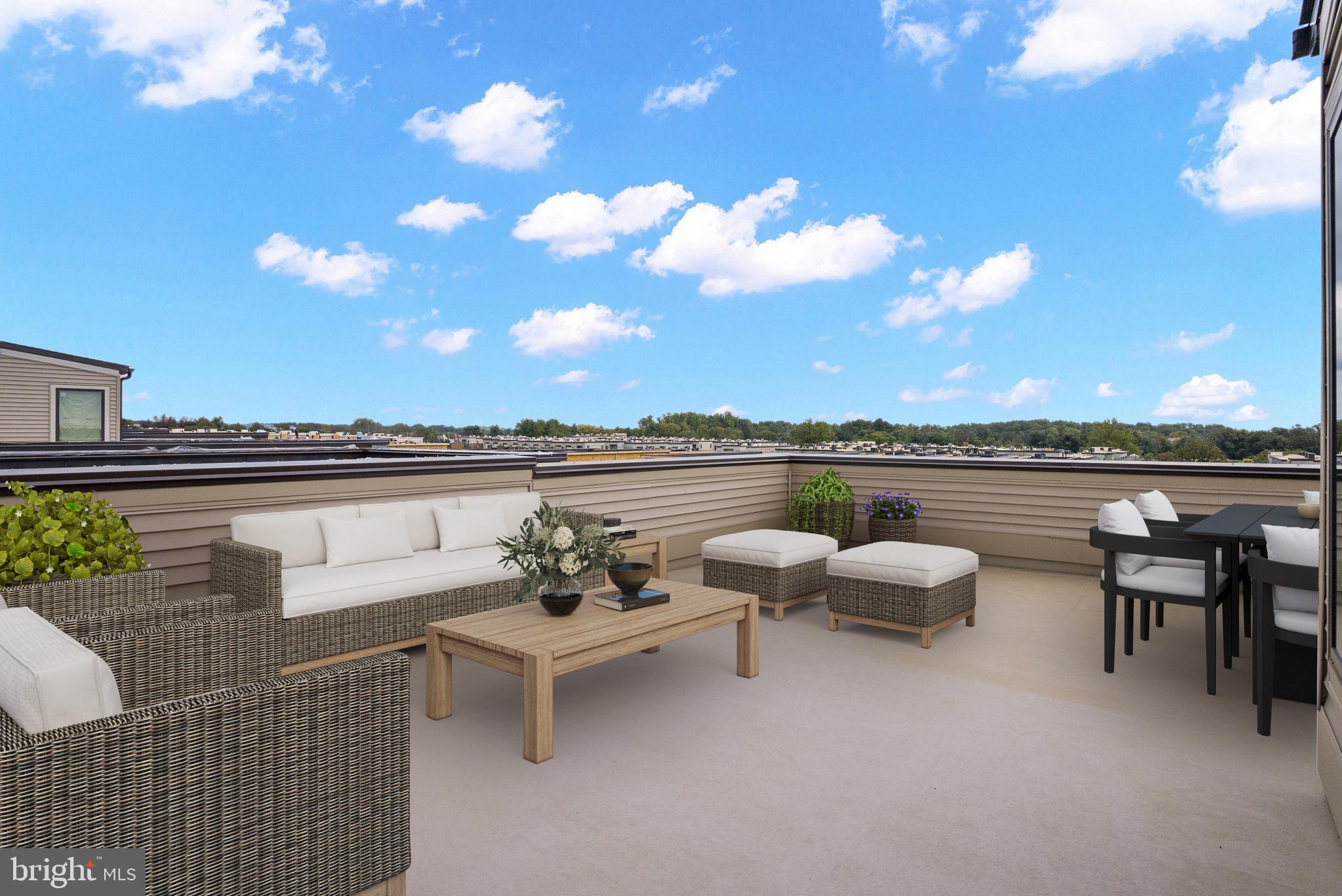 6705 Belcrest Road Hyattsville, MD 20782 - Photo 22 of 32 a view of a patio with couches and table and chairs and potted plants