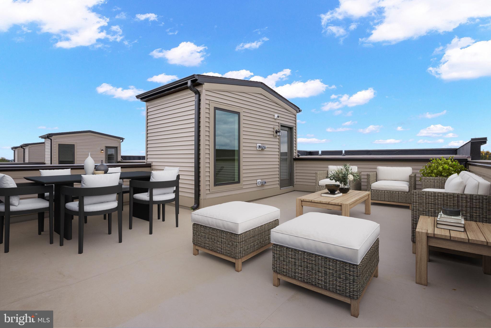 6705 Belcrest Road Hyattsville, MD 20782 - Photo 24 of 32 a view of a patio with dining table and chairs with wooden floor
