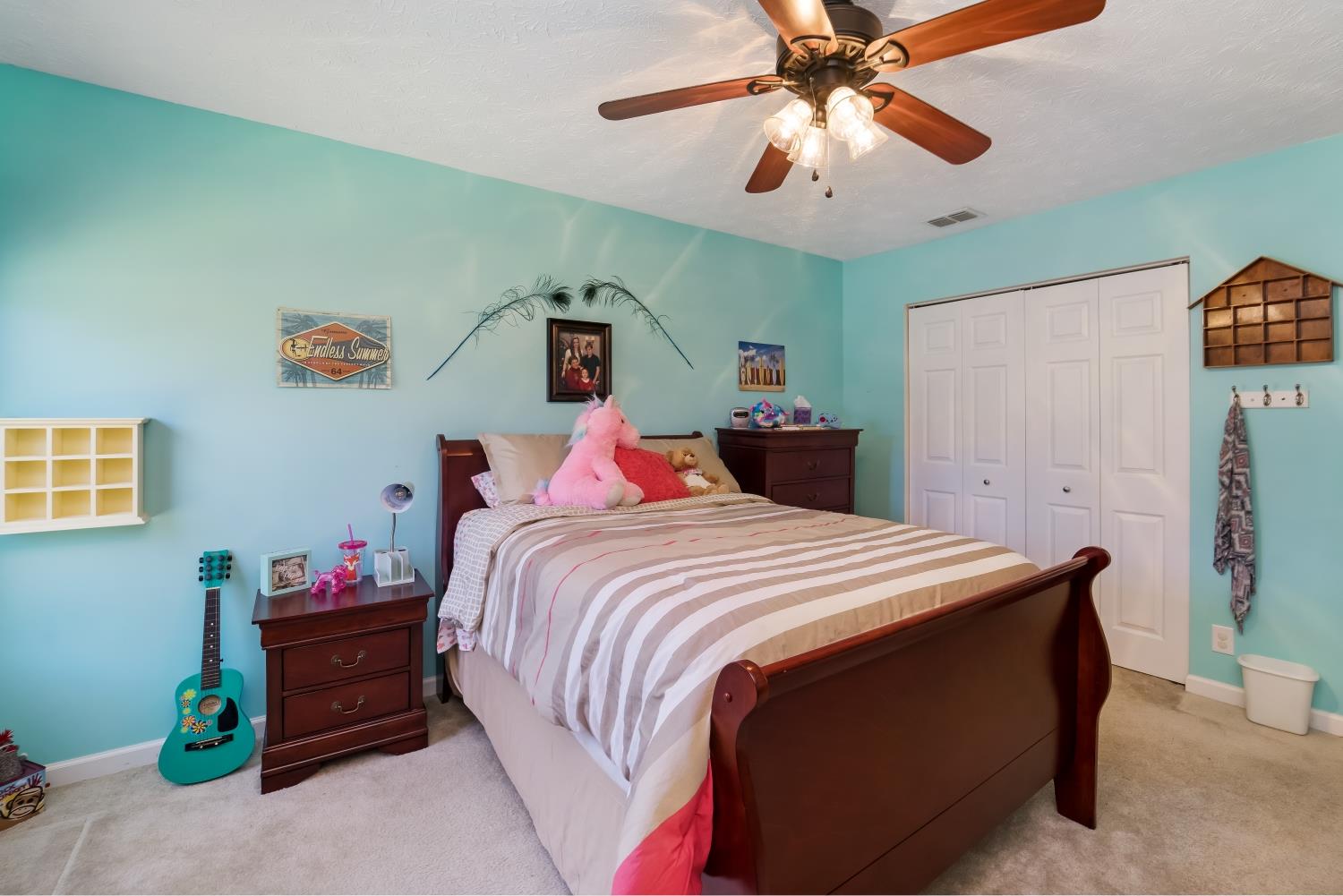 3957 Stephens Ridge Way Antioch, TN 37013 - Photo 19 of 30 a bedroom with a bed and a chandelier