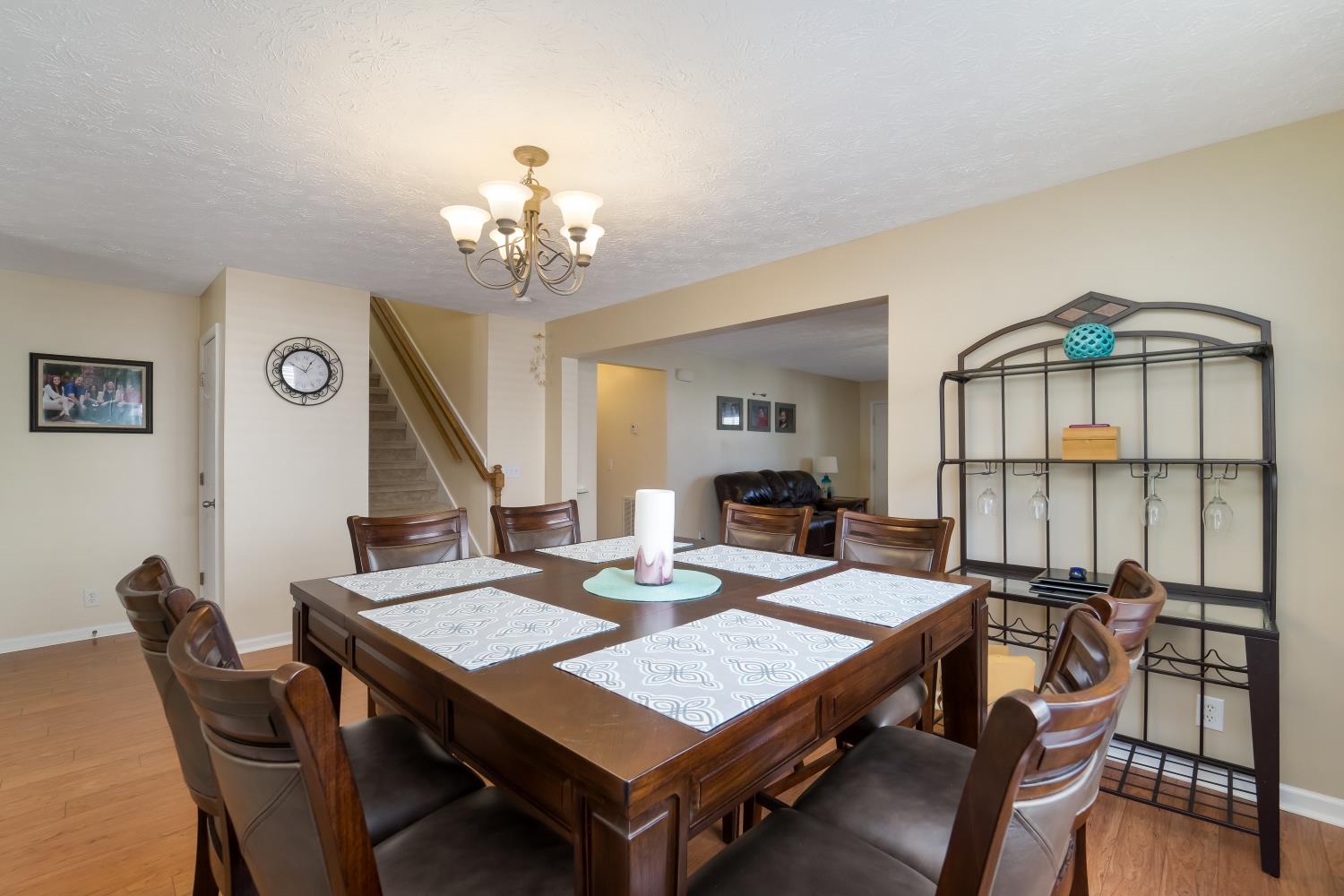 3957 Stephens Ridge Way Antioch, TN 37013 - Photo 6 of 30 a view of a dining room with furniture a chandelier and wooden floor