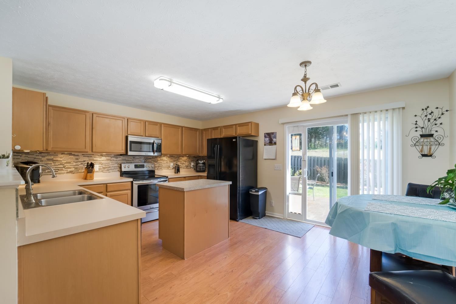 3957 Stephens Ridge Way Antioch, TN 37013 - Photo 8 of 30 a view of kitchen with sink microwave refrigerator and cabinets