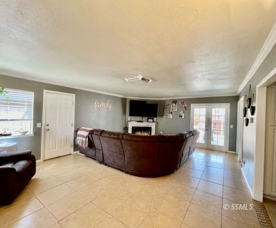 1009 West Iowa Avenue Ridgecrest, CA 93555 - Photo 18 of 26 a living room with furniture and a flat screen tv