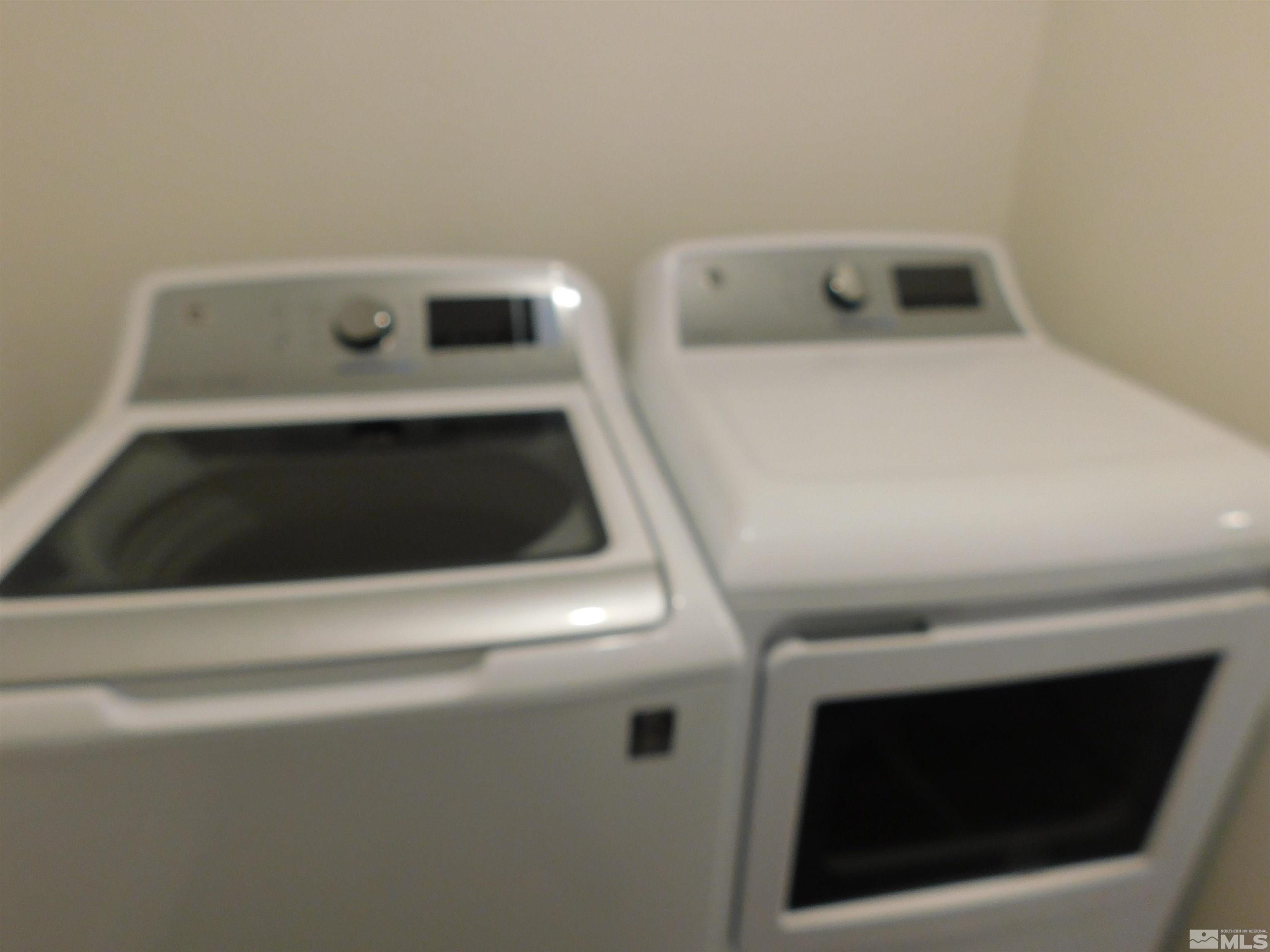 239 Misty Way Dayton, NV 89403 - Photo 13 of 29 a utility room with dryer and washer