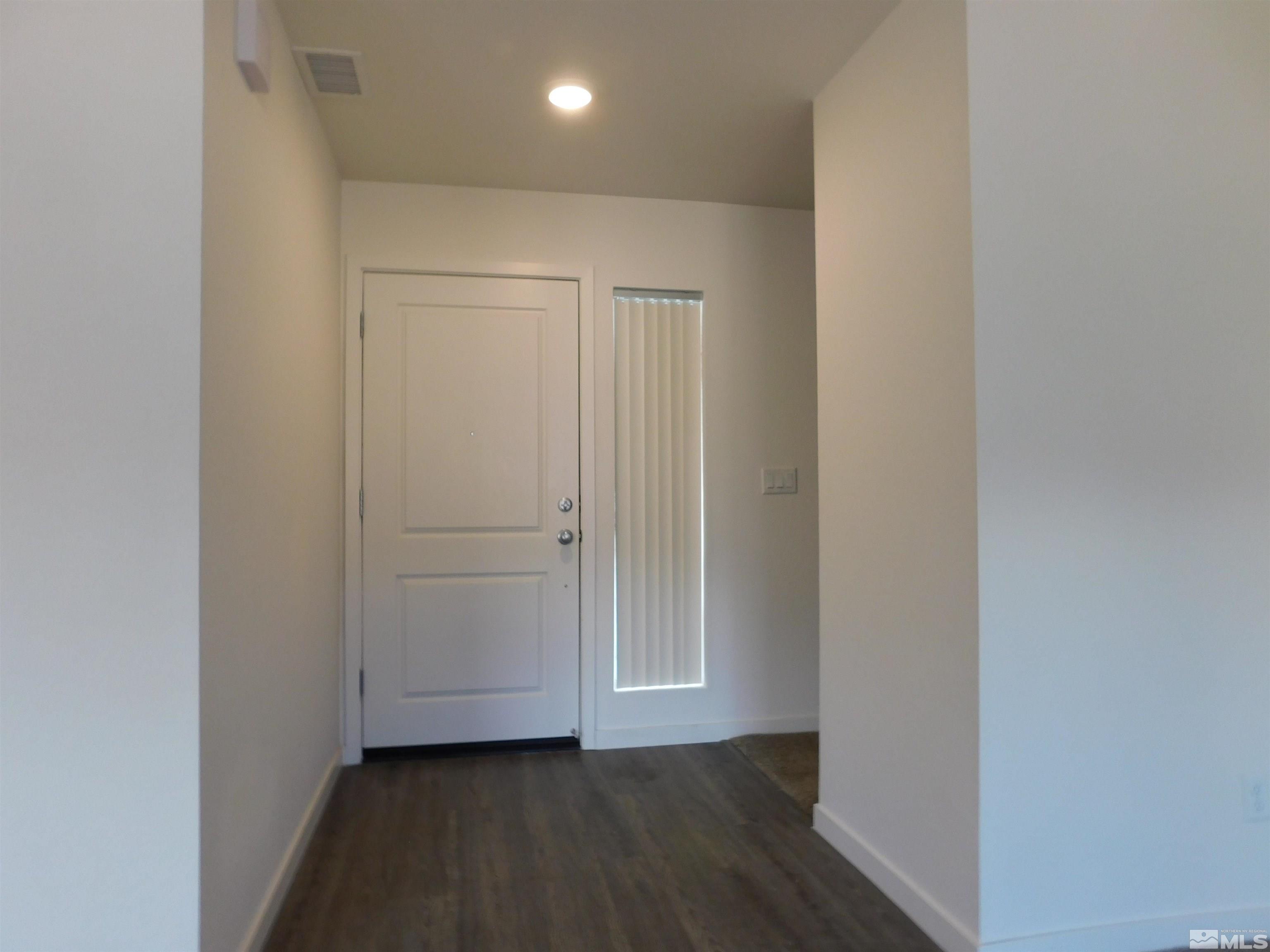 239 Misty Way Dayton, NV 89403 - Photo 20 of 29 a view of a hallway with wooden floor