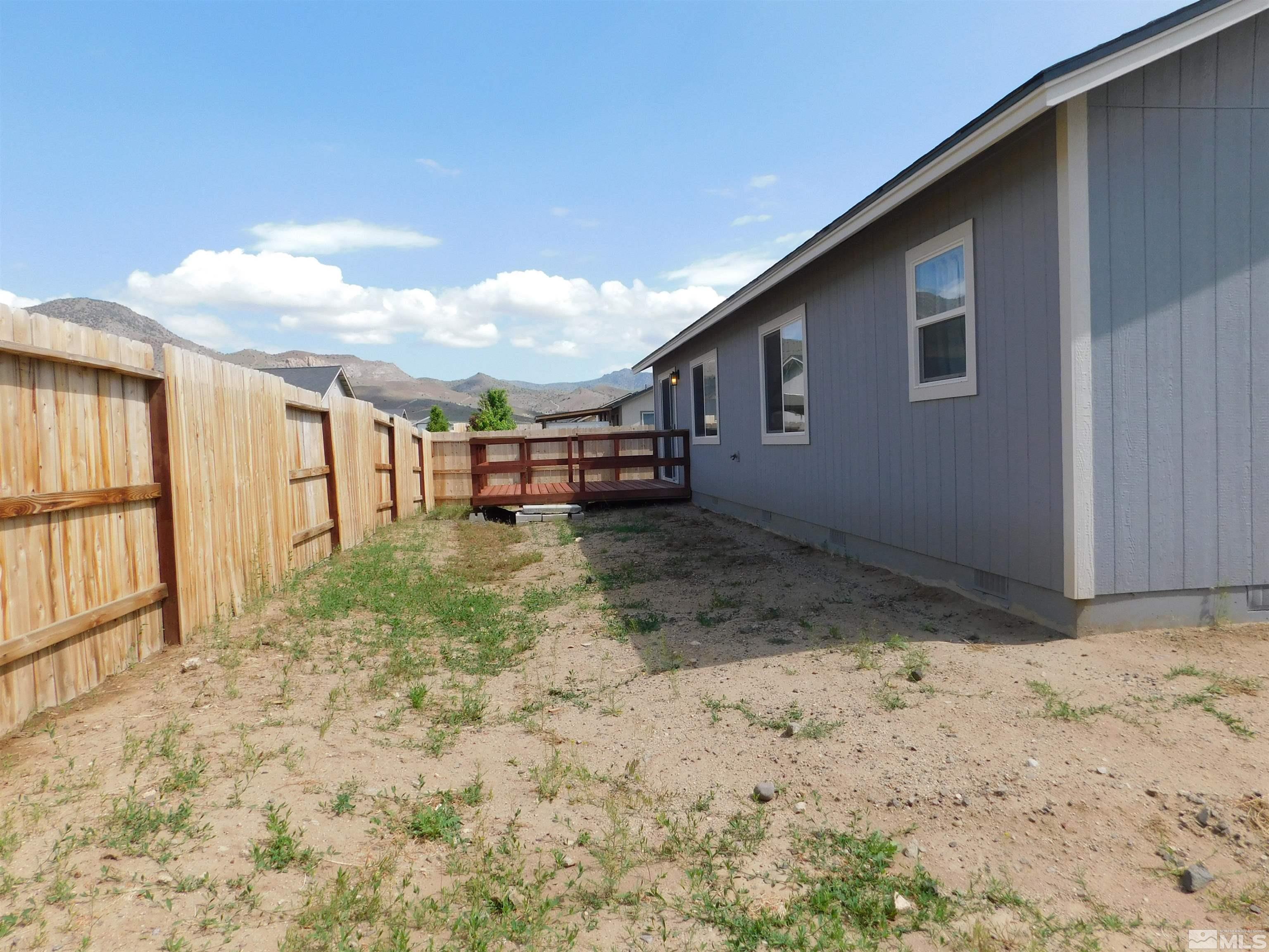 239 Misty Way Dayton, NV 89403 - Photo 24 of 29 a view of a backyard of the house