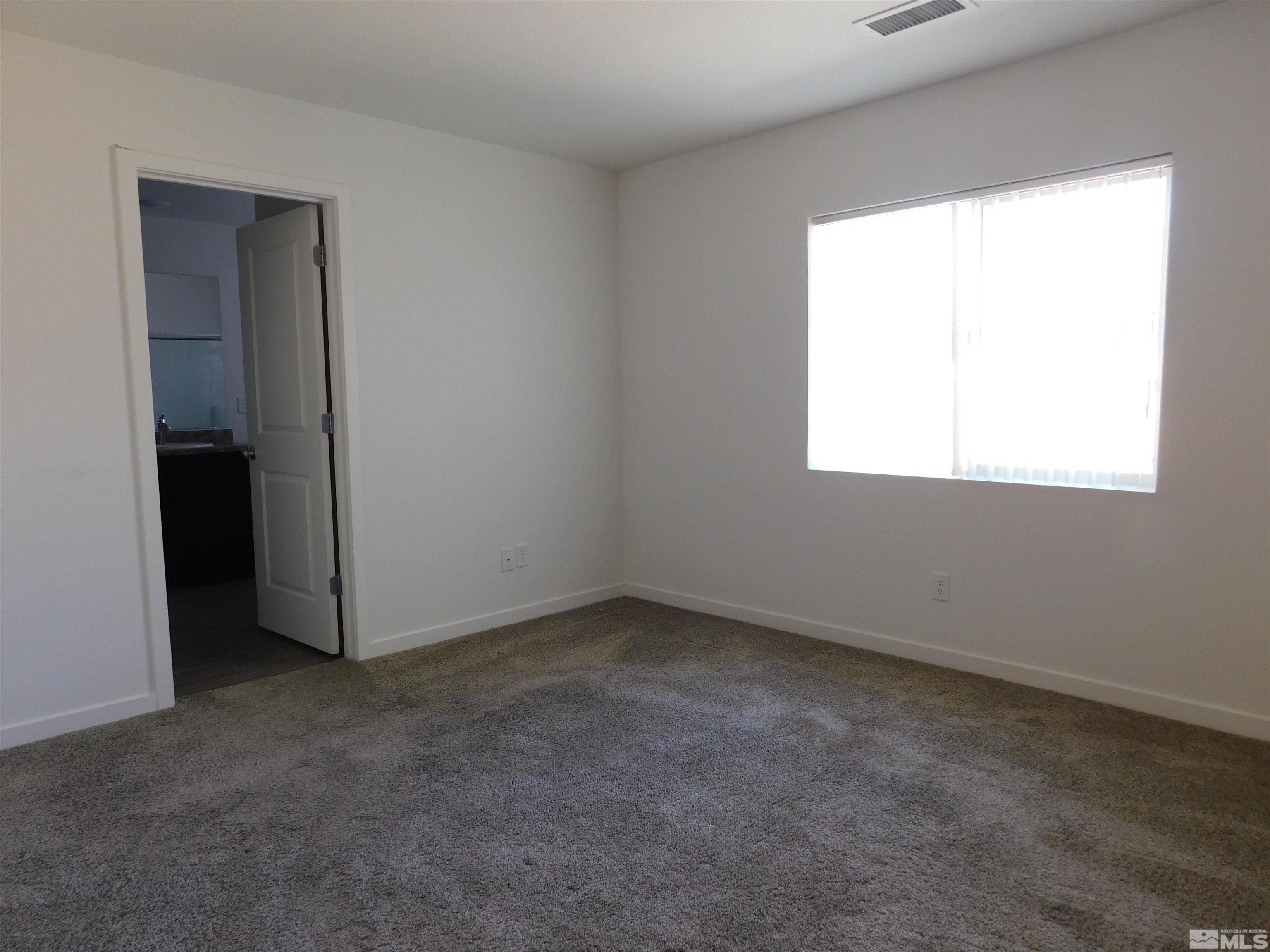 239 Misty Way Dayton, NV 89403 - Photo 6 of 29 an empty room with a window