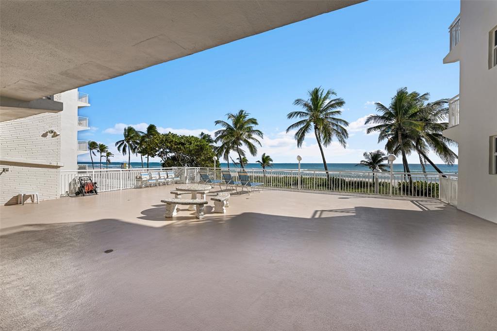 901 South Surf Road, Unit 203 Hollywood, FL 33019 - Photo 15 of 23 a view of swimming pool with a table and chairs