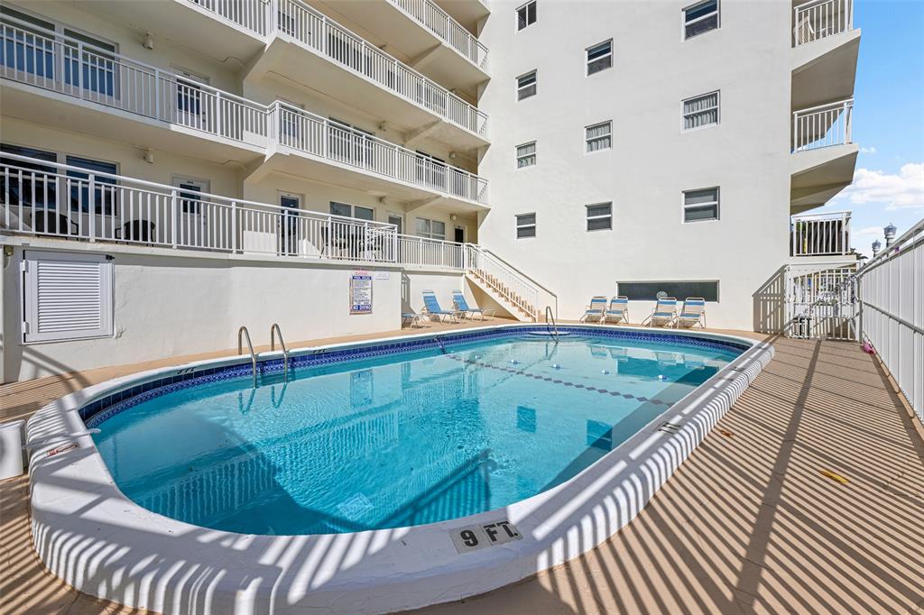 901 South Surf Road, Unit 203 Hollywood, FL 33019 - Photo 18 of 23 a view of a swimming pool with a balcony