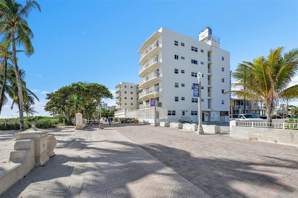 901 South Surf Road, Unit 203 Hollywood, FL 33019 - Photo 2 of 23 a street view with tall buildings