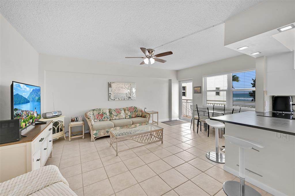 901 South Surf Road, Unit 203 Hollywood, FL 33019 - Photo 4 of 23 a living room with furniture and view of kitchen