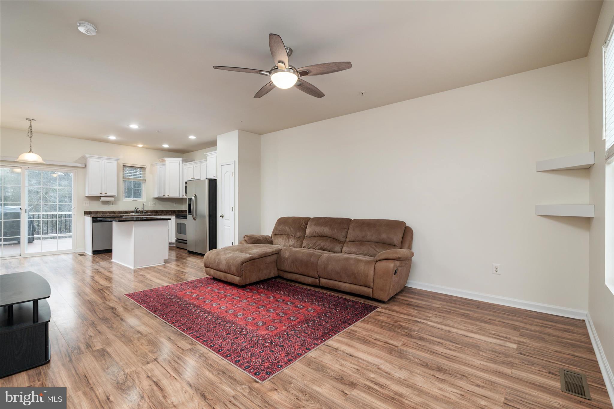 1013 Sithean Way Glen Burnie, MD 21060 - Photo 14 of 35 a living room with furniture and kitchen view