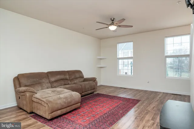 a living room with furniture and a rug