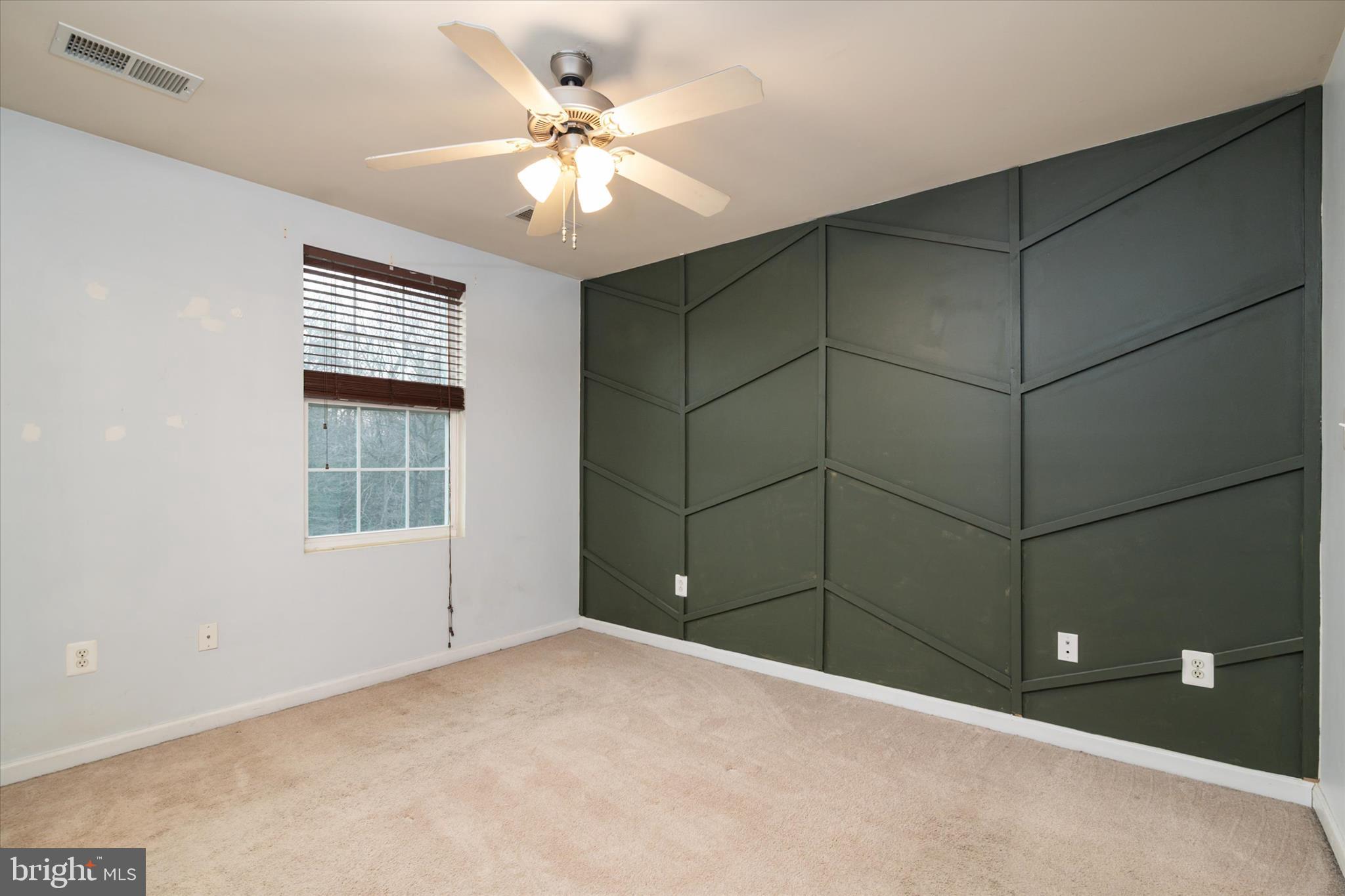 1013 Sithean Way Glen Burnie, MD 21060 - Photo 17 of 35 a view of a livingroom with a ceiling fan and window