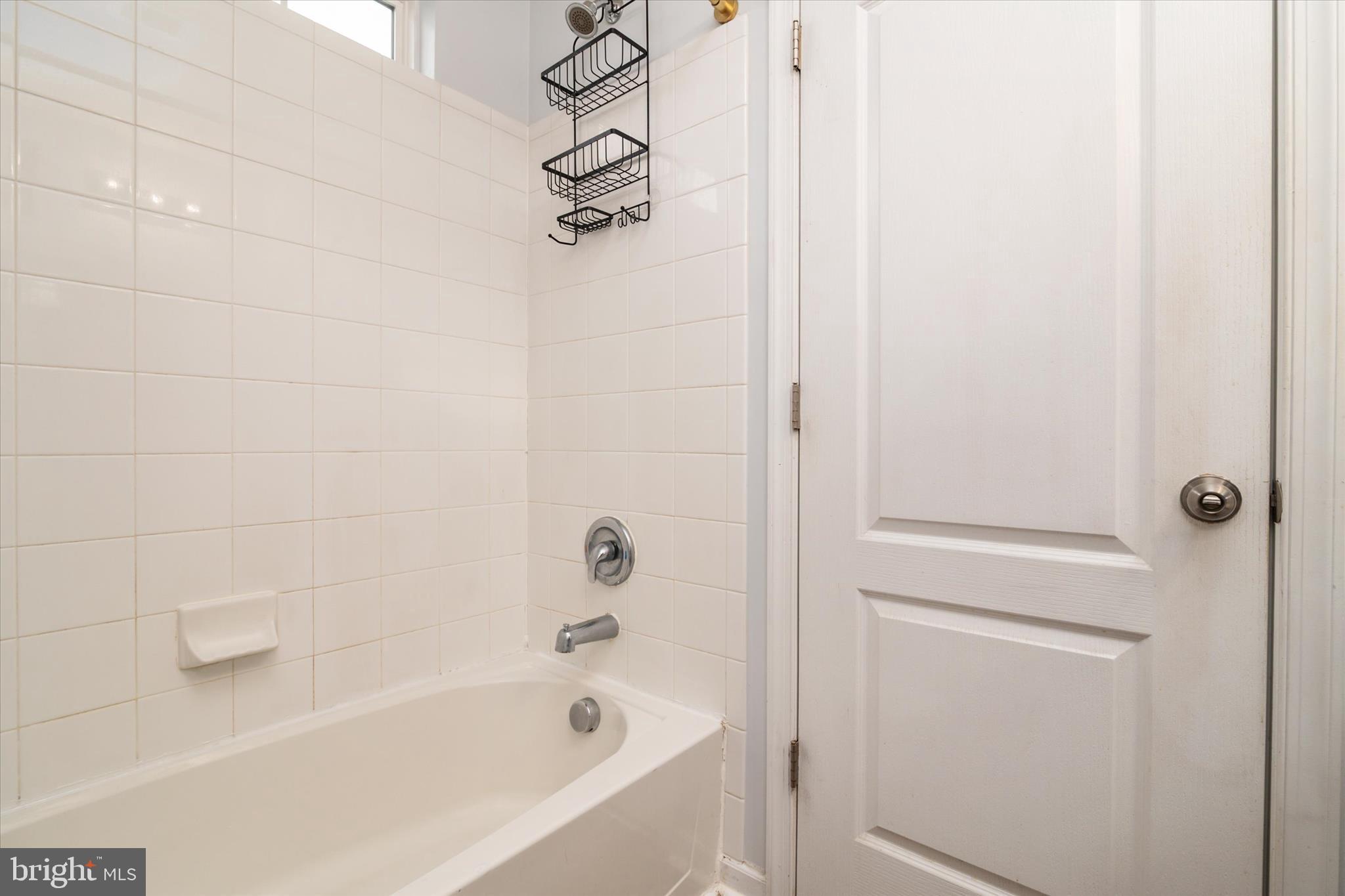 1013 Sithean Way Glen Burnie, MD 21060 - Photo 20 of 35 a bathroom with a bathtub