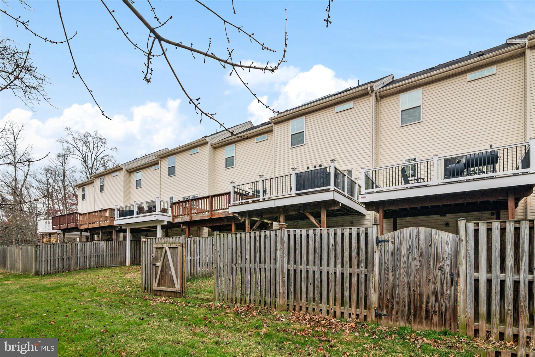 1013 Sithean Way Glen Burnie, MD 21060 - Photo 28 of 35 a view of a house with a wooden deck
