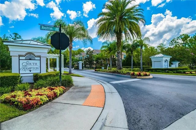 a view of a garden with palm trees