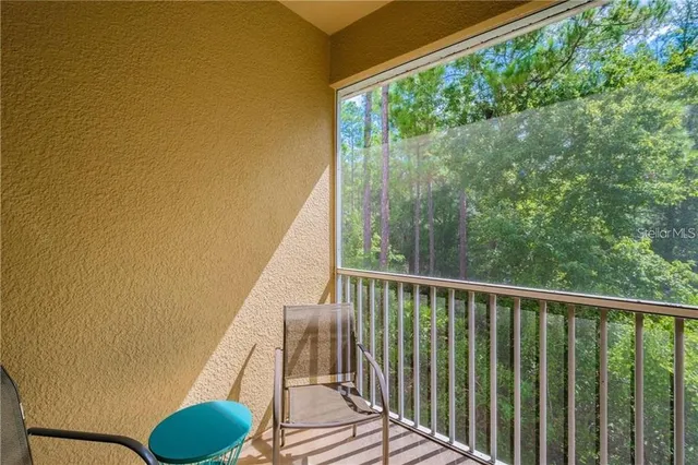 a view of balcony with furniture