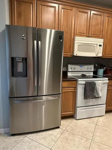 a kitchen with appliances and cabinets