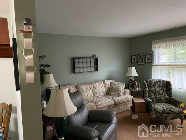 44 Purdue Road Old Bridge, NJ 08859 - Photo 5 of 7 a living room with furniture and a lamp