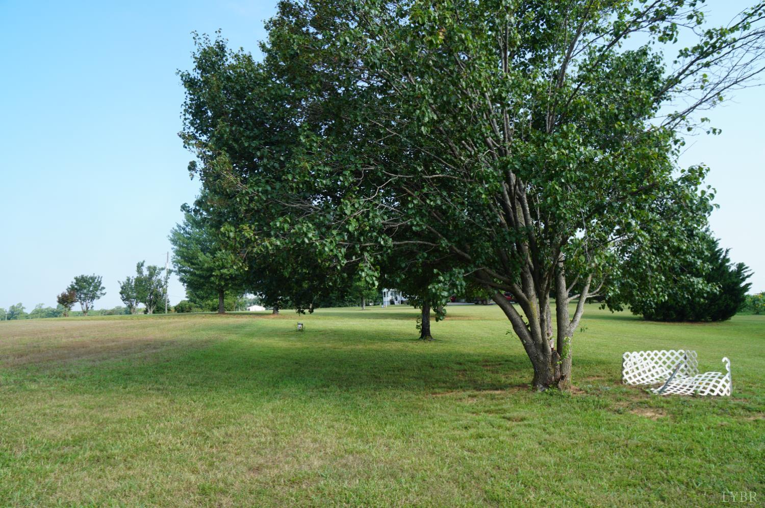 1472 Emery Road Chatham, VA 24531 - Photo 6 of 8 a big yard with lots of green space and trees