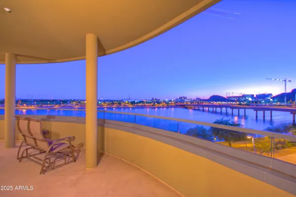 a view of a balcony with an ocean