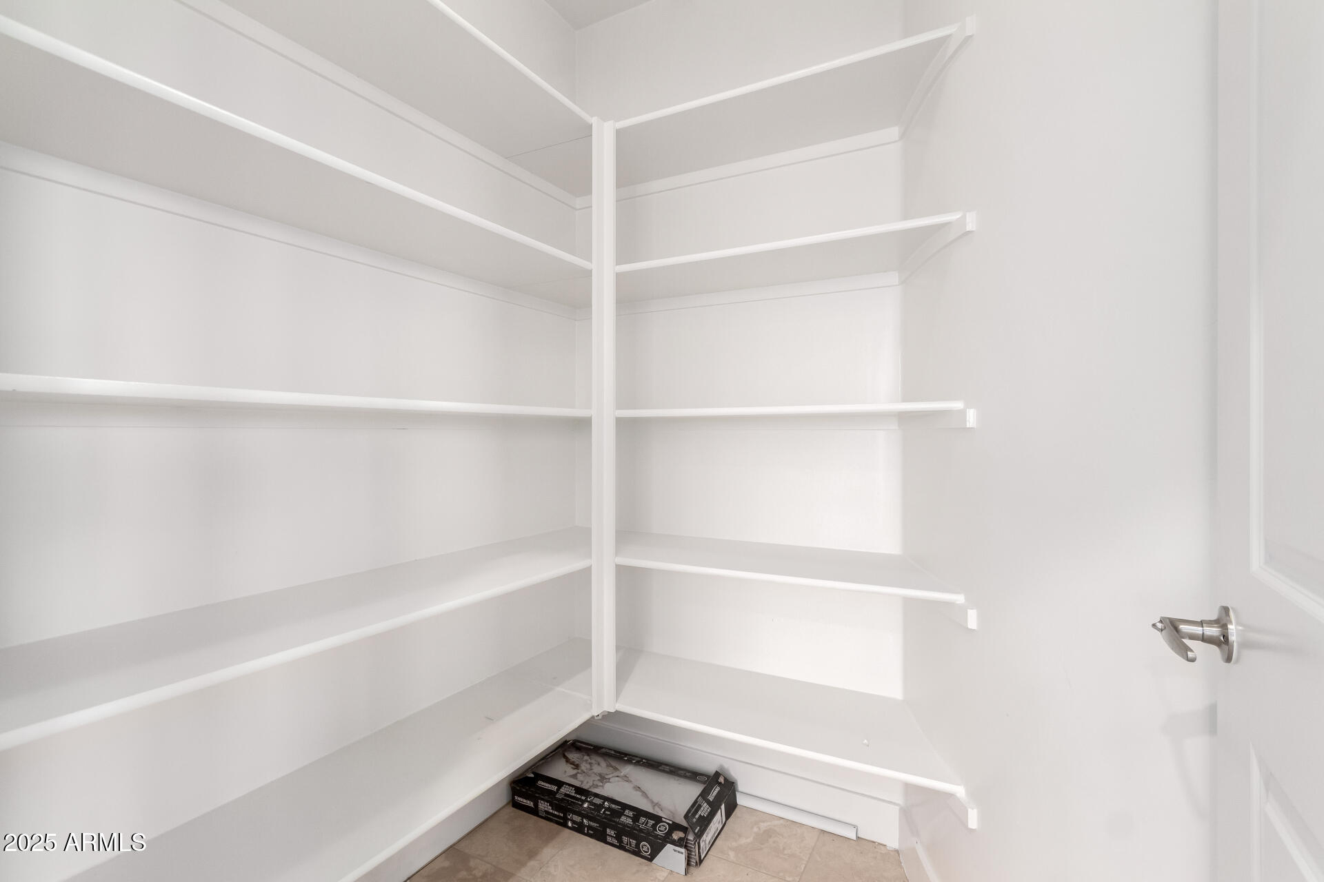 945 East Playa Del Norte Drive, Unit 3013 Tempe, AZ 85288 - Photo 12 of 36 a view of walk in closet with empty racks