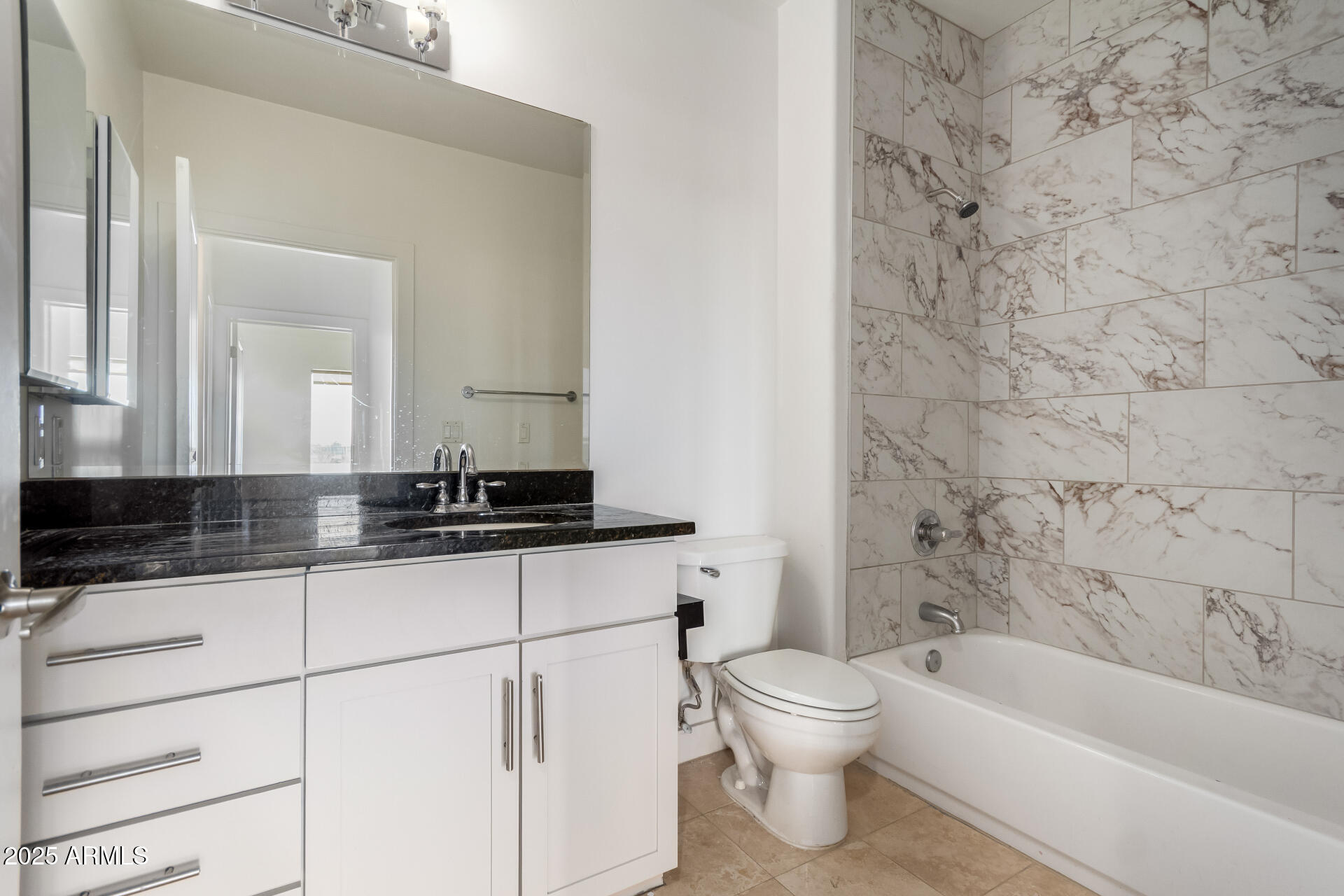 945 East Playa Del Norte Drive, Unit 3013 Tempe, AZ 85288 - Photo 15 of 36 a bathroom with a sink a toilet a mirror and bathtub